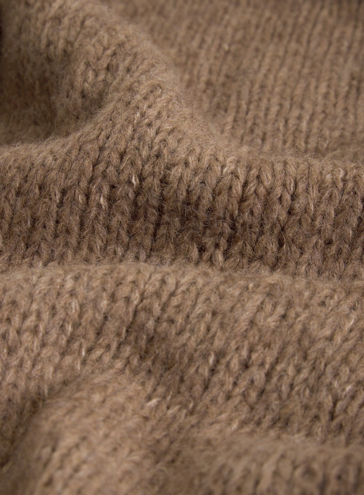 Close-up of brown knitted fabric texture