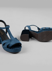 Pair of Esska Charlie Blue Velvet T Bar Heels on a grey background. Front and Underneath shot showcasing the embossed velvet detail and the block heel tread.