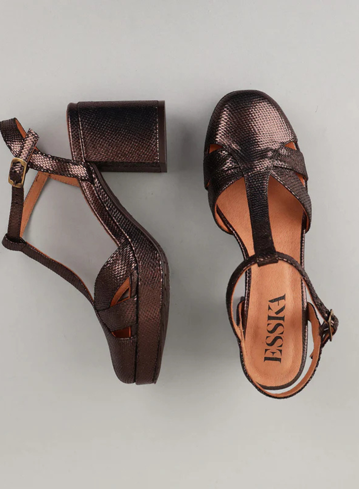 Pair of Esska Celeste Dark Brown Metallic Platform Block Heels against a grey background. Overhead and side shot showcasing the block heel and the closed round toe shape of the metallic heels.