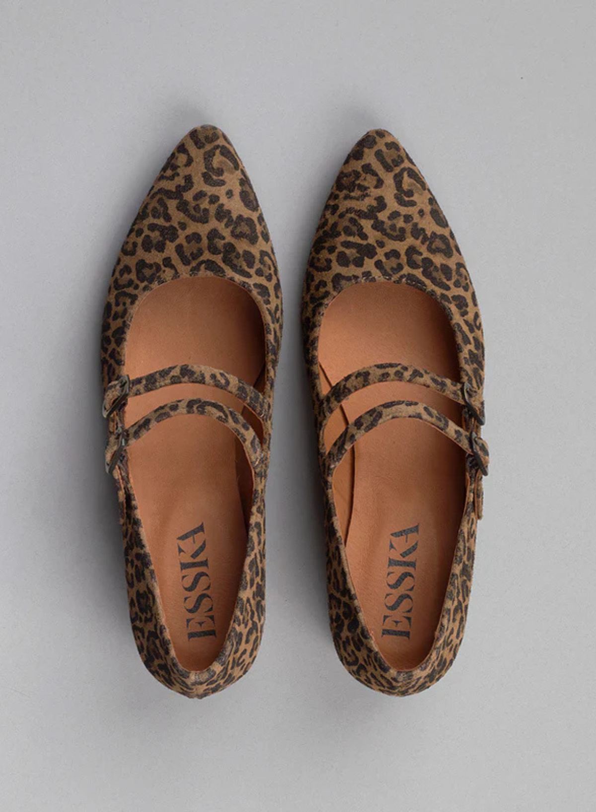 Pair of Esska Laura Low Leopard Heels against a grey background. Overhead shot showcasing the pointed toe shape of these suede leopard Mary Janes.