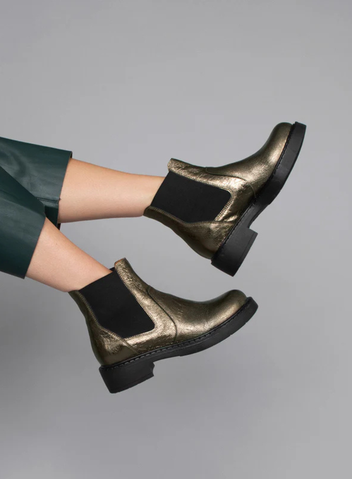 Woman wearing the Esska Bora Graphito Leather Chelsea Boots. Side shot showcasing the elasticated side panels and block heels of these ankle boots.