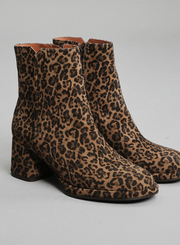 Pair of Esska Mona Leopard Print Boots on a grey background showcasing the all over leopard print pattern and the round toe shape of these ankle boots.
