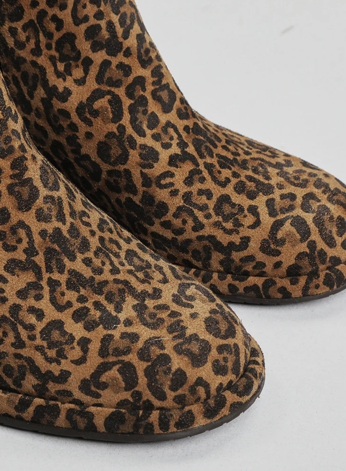 Close up shot of the Esska Mona Leopard Print Boots. Showcasing the print and round toe shape of these suede ankle boots.