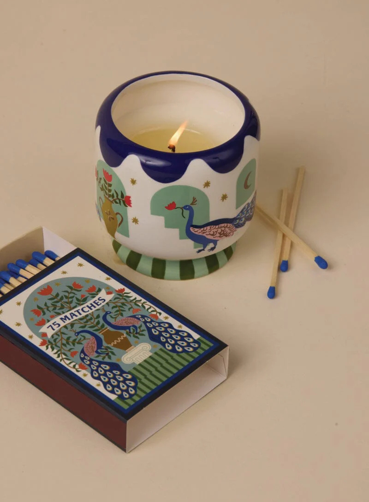 A Dopo 8oz Peacock Ceramic Candle in Misted Lime from Paddywax