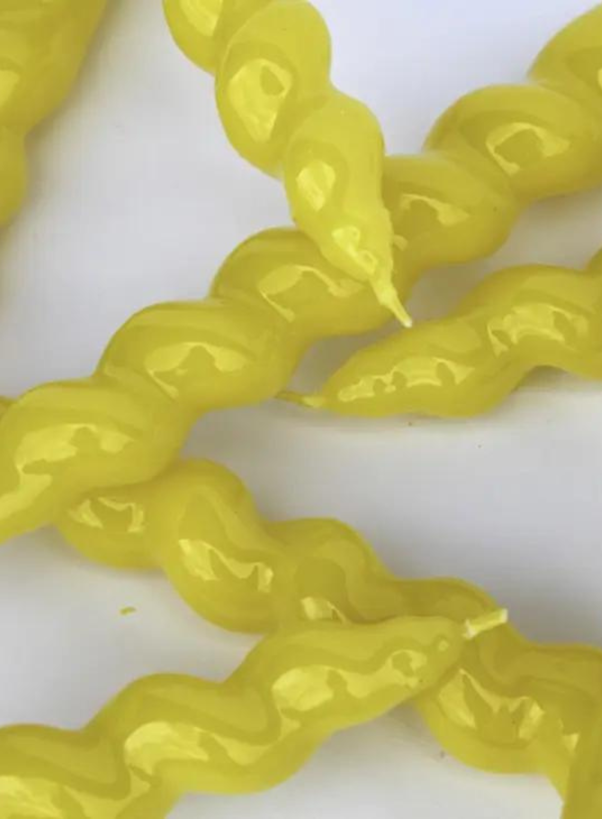 Spiral Taper Candle in Yellow from MÆGEN